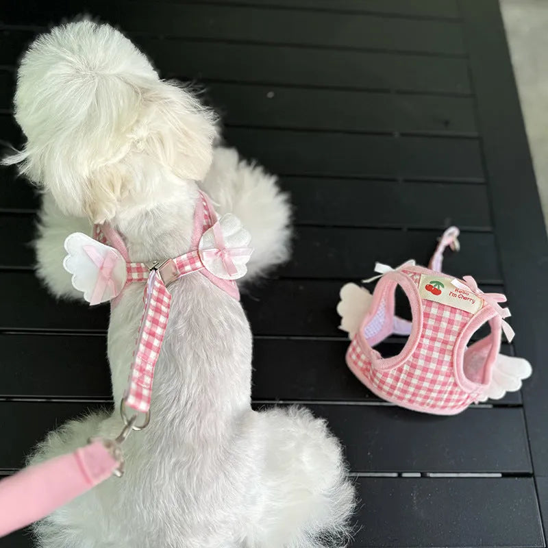 Pink cotton harness and lead set for a small dog with chest and back attachment points.