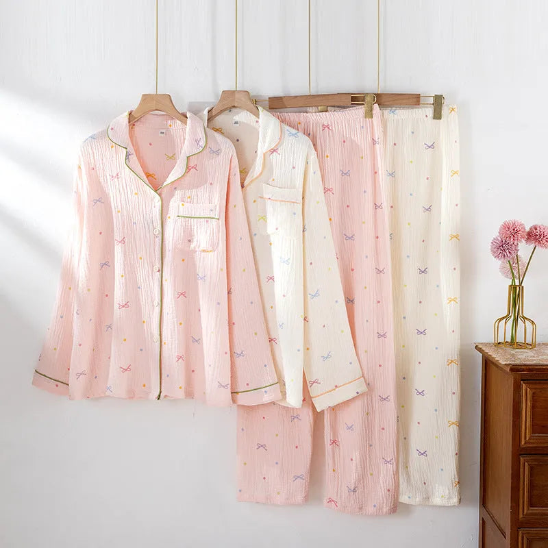 Women's thin cotton long-sleeve pajama set in beige, showing top and trousers laid flat.
