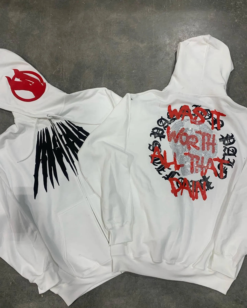 Black hooded sweatshirt with printed skull pattern and rhinestone detailing, cardigan style with loose fit