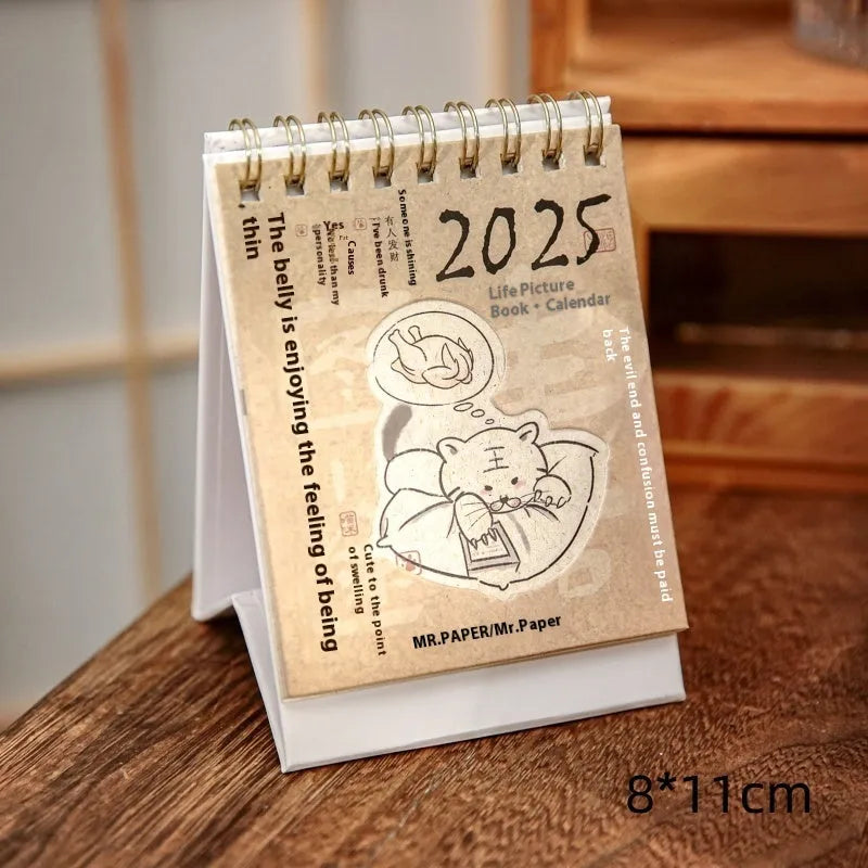 Mini coffee desk calendar 2025 with four design options on small desk surface