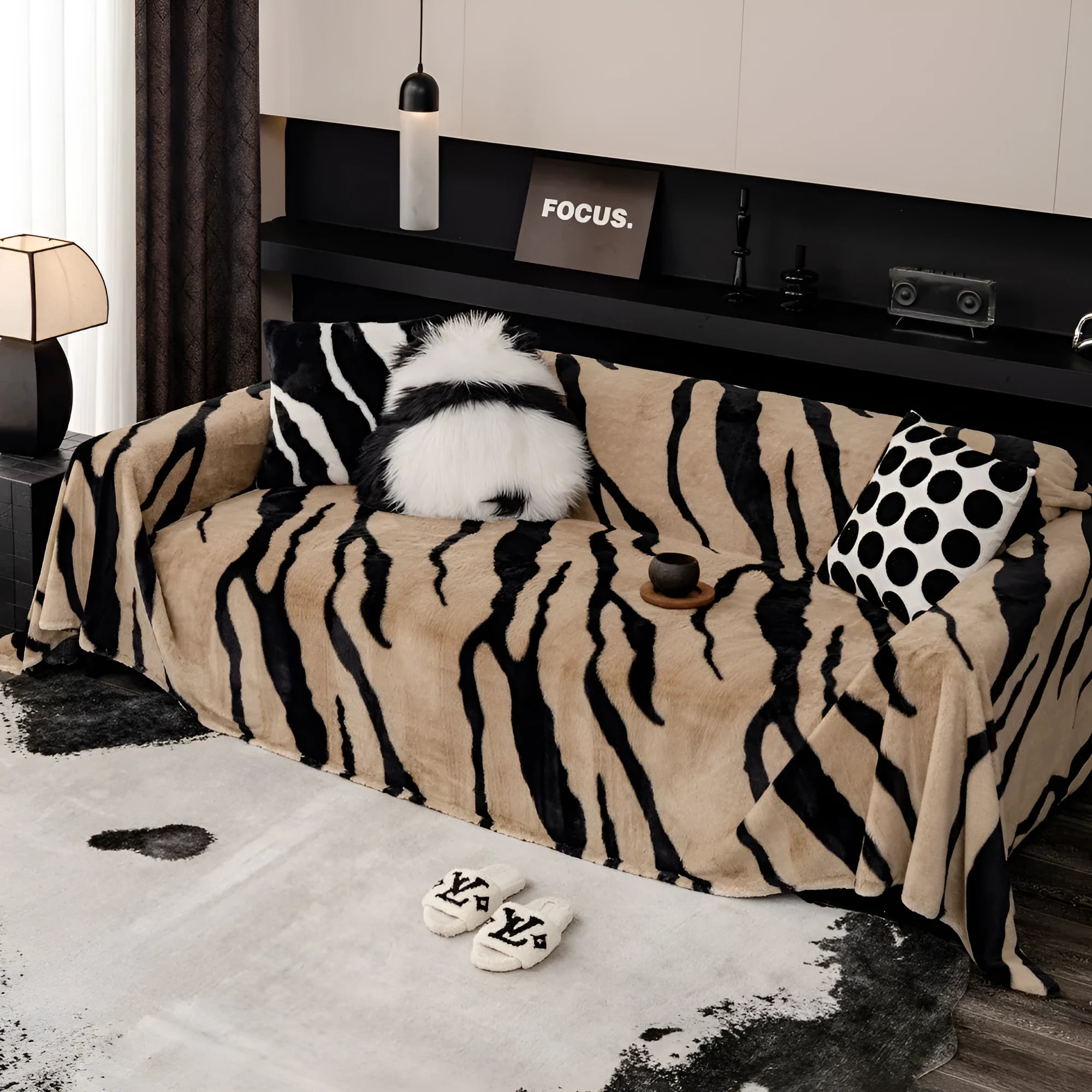 Zebra pattern thickened flannel sofa cover in caramel colour with matching pillowcase on a grey sofa.