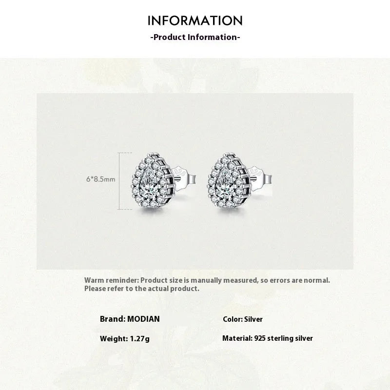 Women's silver water drop ear studs in 925 sterling silver with diamond treatment finish