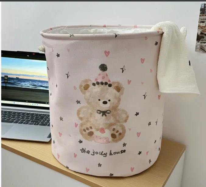Foldable cotton cloth laundry basket in a character print colour, shown unfolded for use.