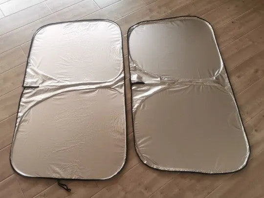 Aluminium foil car windscreen sunshade folded, showing reflective titanium silver surface and size options.