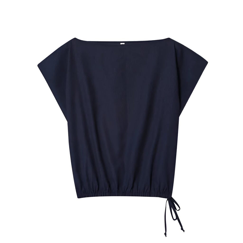 Women's linen-style shirt with flounced sleeves and matching wide-leg trousers co-ord set.