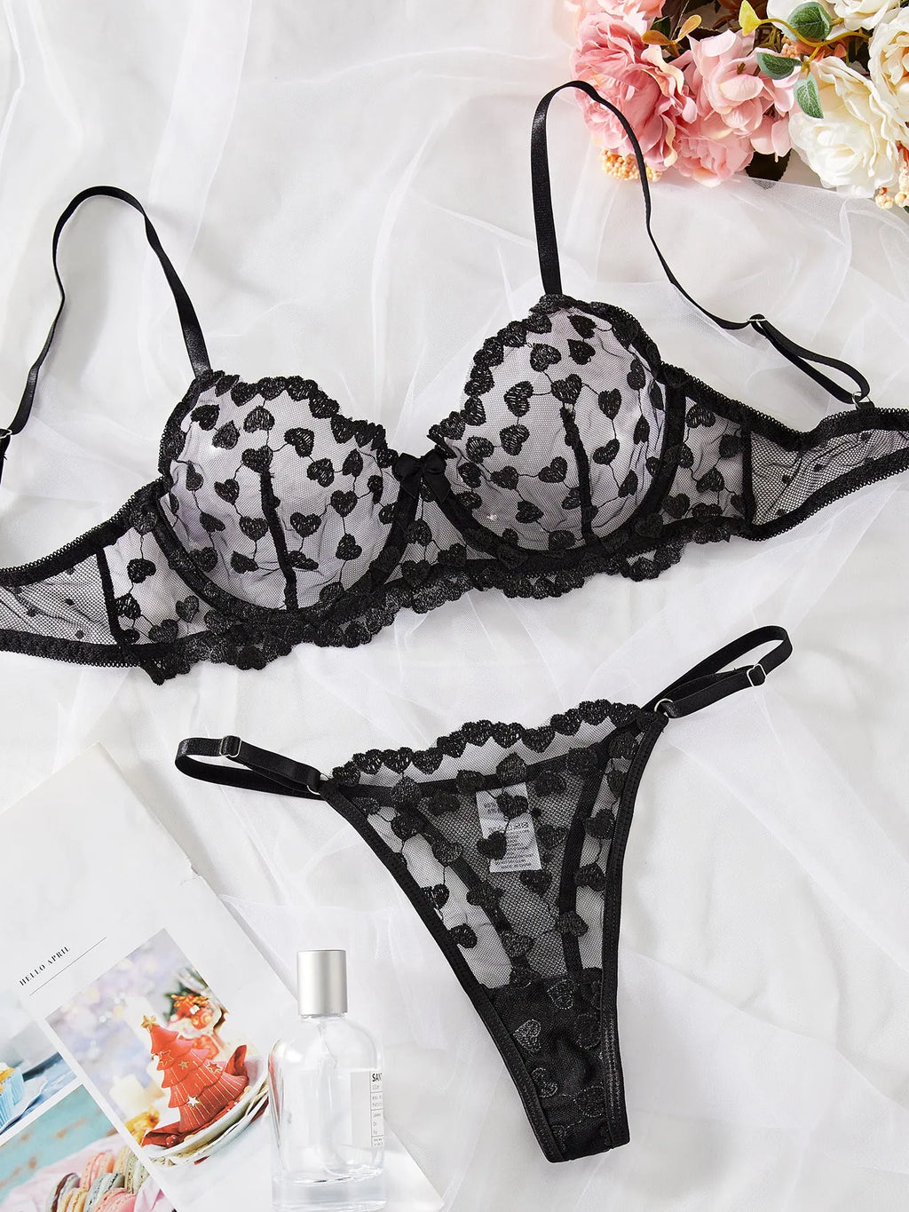 Women's black mesh two-piece suit set with top and trousers for special occasions.