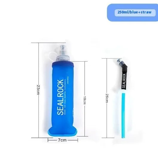 Close-up of a grey flexible plastic hydration straw with a textured grip and a blue silicone cap for mountain biking