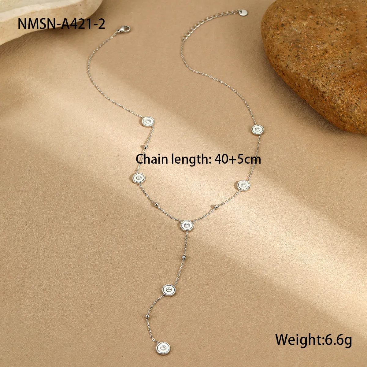 Women's stainless steel bracelet and necklace set with 18K gold plating and geometric design.