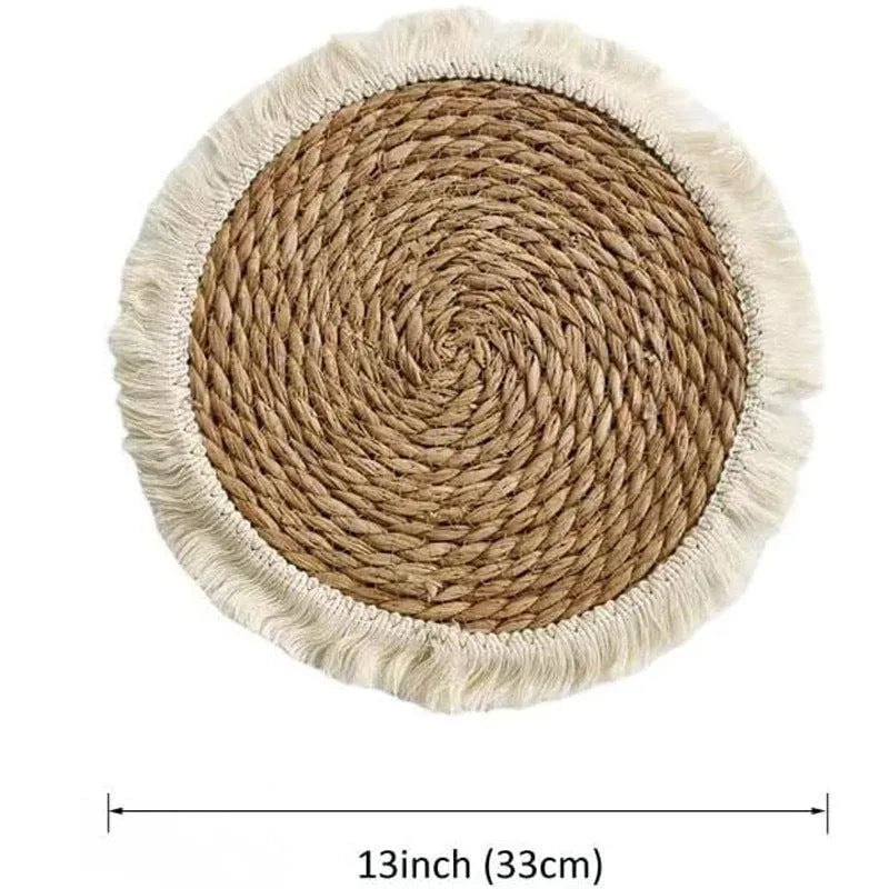 Round Japanese straw placemat with corn rope tassels in natural papyrus colour on wooden table