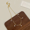 Geometric zircon necklace, earrings, and anklet set in a Korean-style meteor shower design.