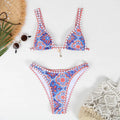 Women's retro-style printed swim bikini set in orange, pink, black, and blue colours on a mannequin.