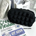 Cream Puff fabric pencil case in beige or black colour made from polyester material