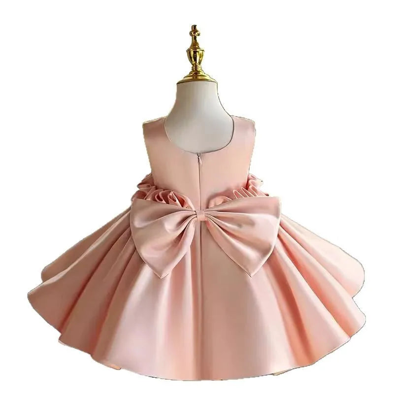 Children's princess dress in flesh pink polyester for piano performance with full skirt and fitted bodice