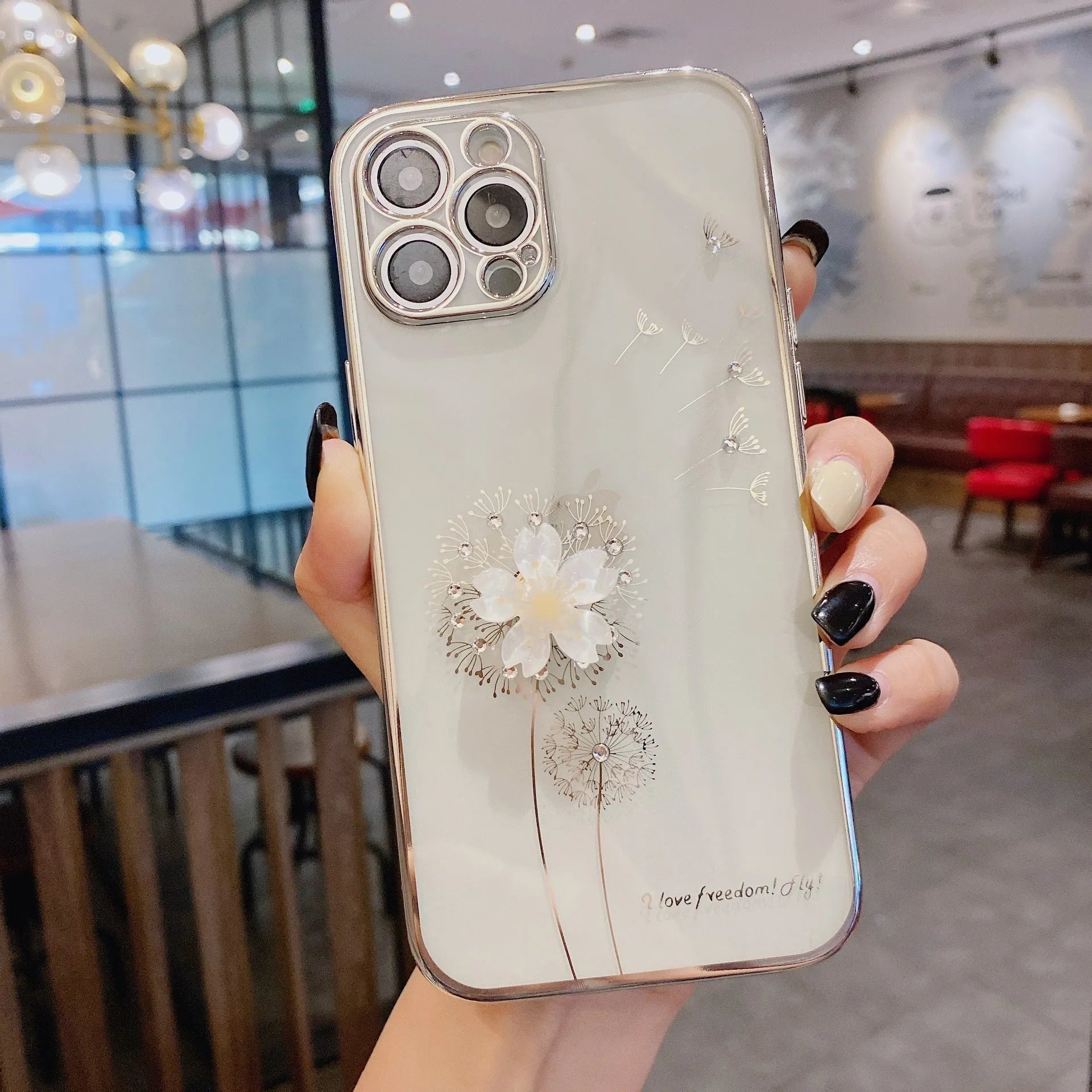 Green TPU iPhone case with a spinning 3D pink flower stand on the back