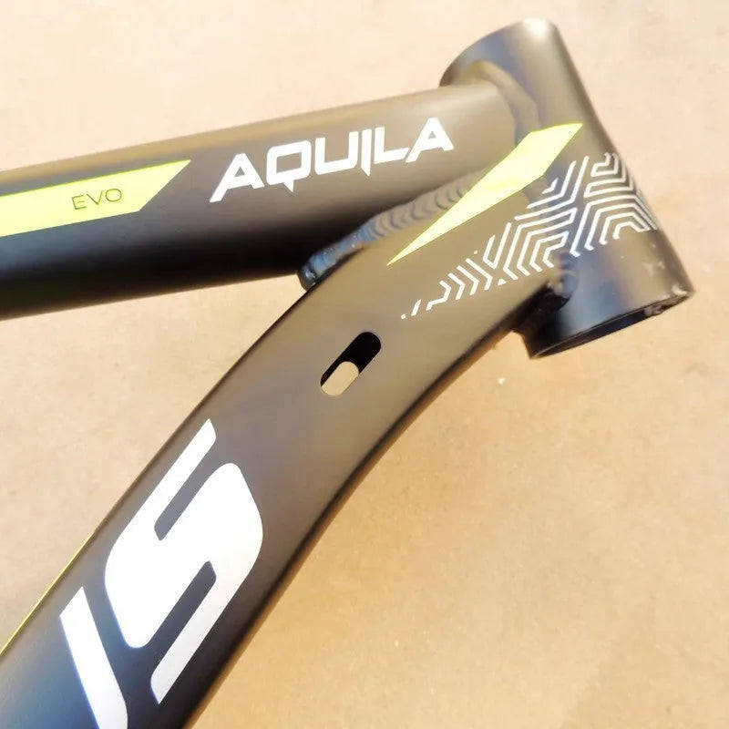 29-inch black green aluminium mountain bike frame showing inner cable routing ports and disc brake mount