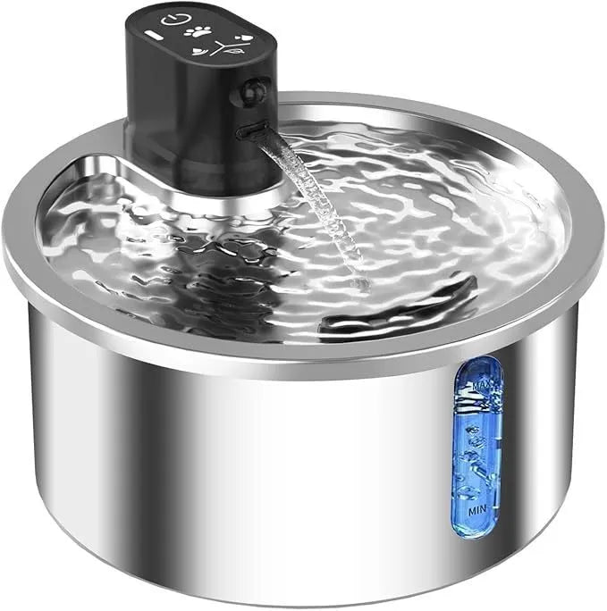 Stainless steel pet water fountain with white heating base on a kitchen floor