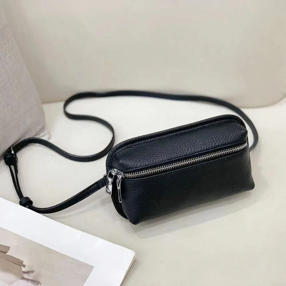 Women's mini crossbody bag in solid colour top grain leather with patchwork detail, horizontal square shape, retractable handle