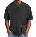 Man wearing a light blue cotton blend waffle knit short sleeve casual T-shirt.
