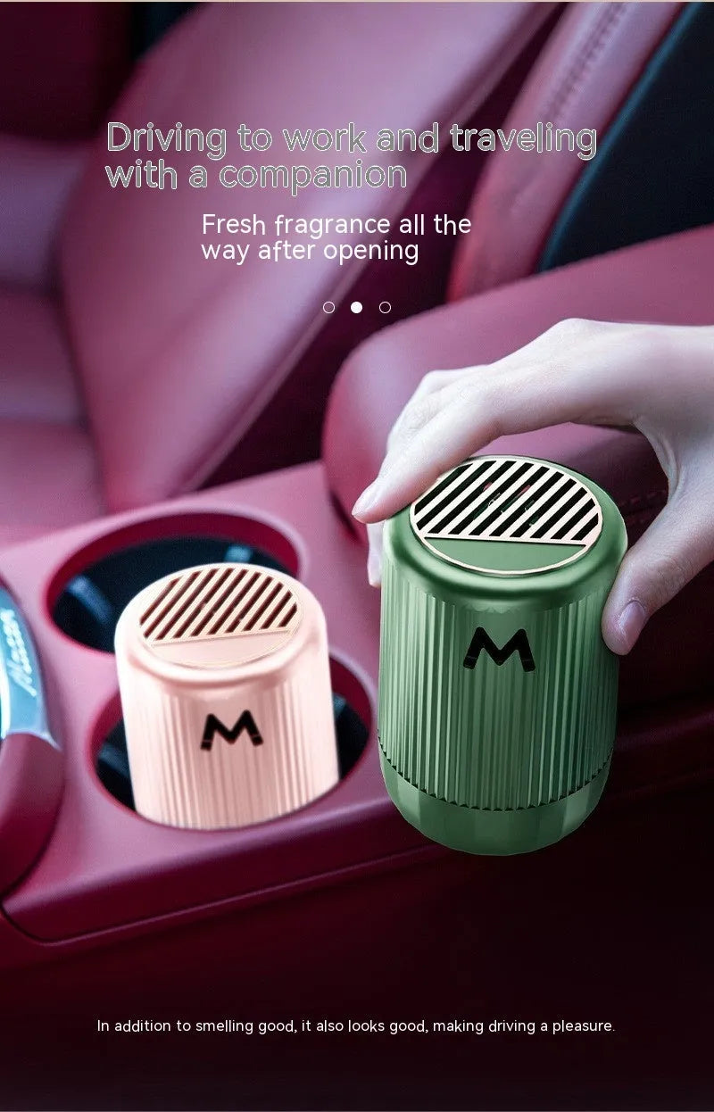 Solid car aromatherapy decoration cup in choice of four scents, measuring 10 by 6 centimetres.