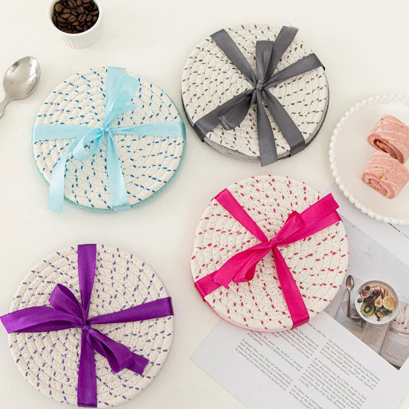 Three round cotton cord coasters in 18cm diameter showing grey, pink, purple and blue colour options