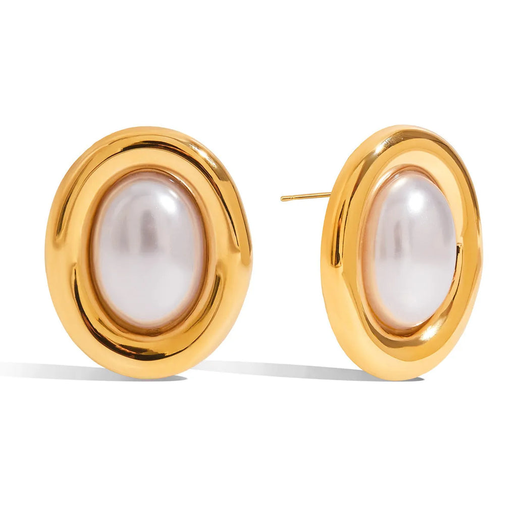 A pair of stainless steel vintage pearl stud earrings for women with a post-back closure.