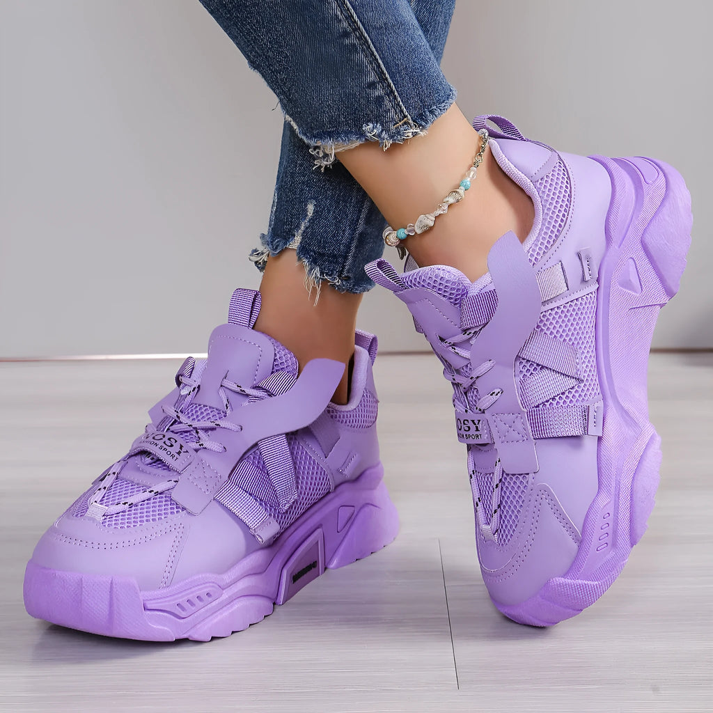 Women's purple green white pink yellow mesh platform sneakers with lace-up front and animal pattern.