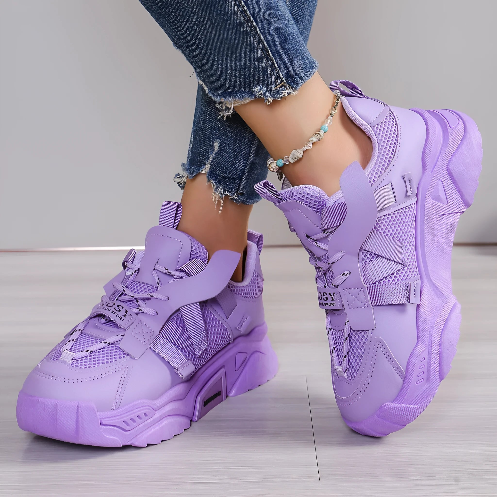 Women's purple green white pink yellow mesh platform sneakers with lace-up front and animal pattern.