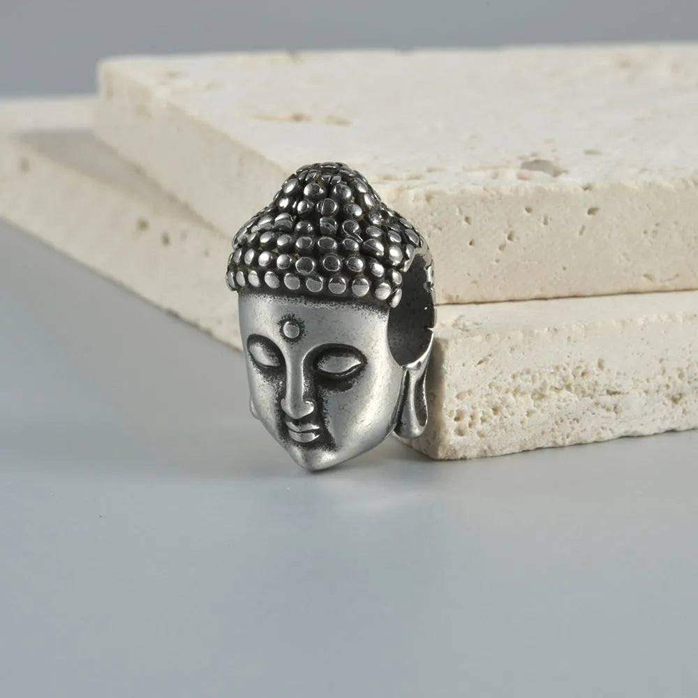 Stainless steel hollow geometric skull and Buddha head earrings with electroplated finish