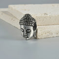 Stainless steel hollow skull and Buddha geometric design earrings in hip hop style.
