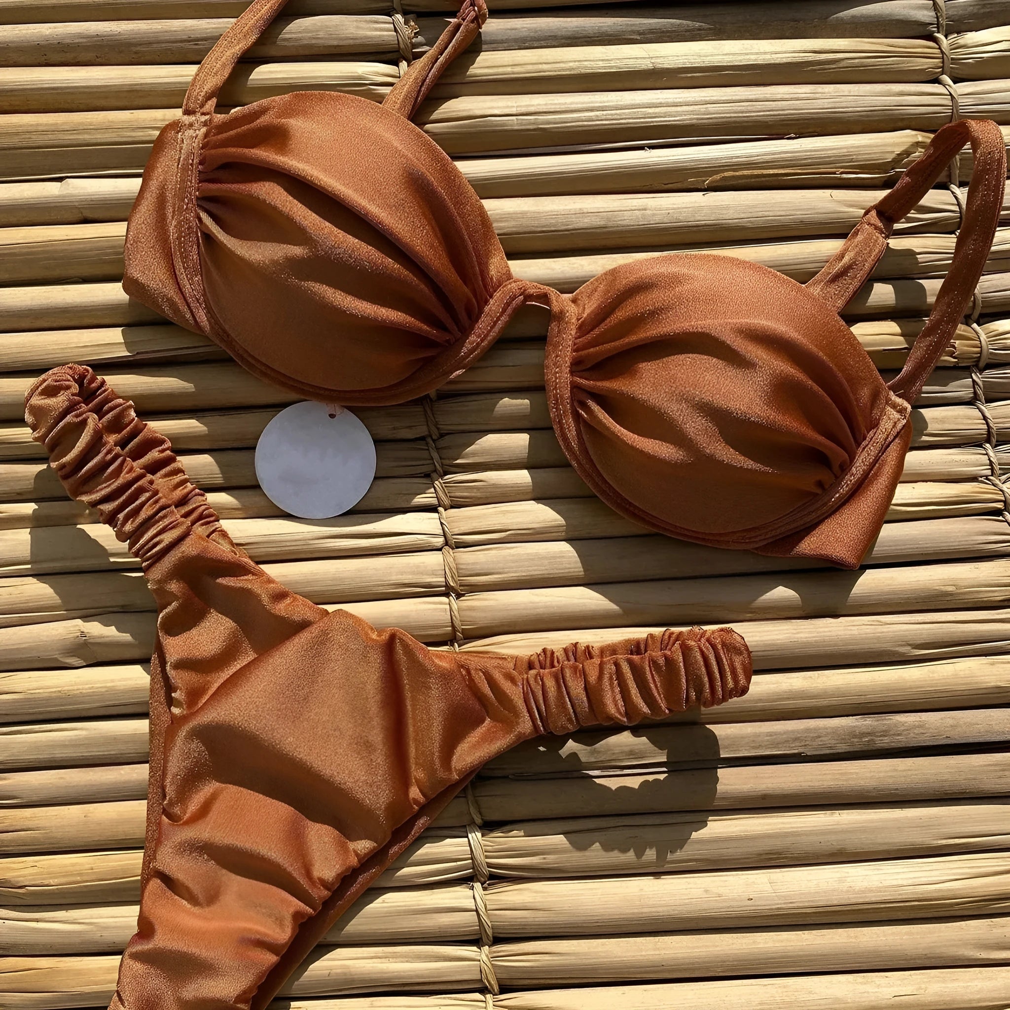 Women's black underwire bikini swimsuit on a mannequin, showing briefs style.