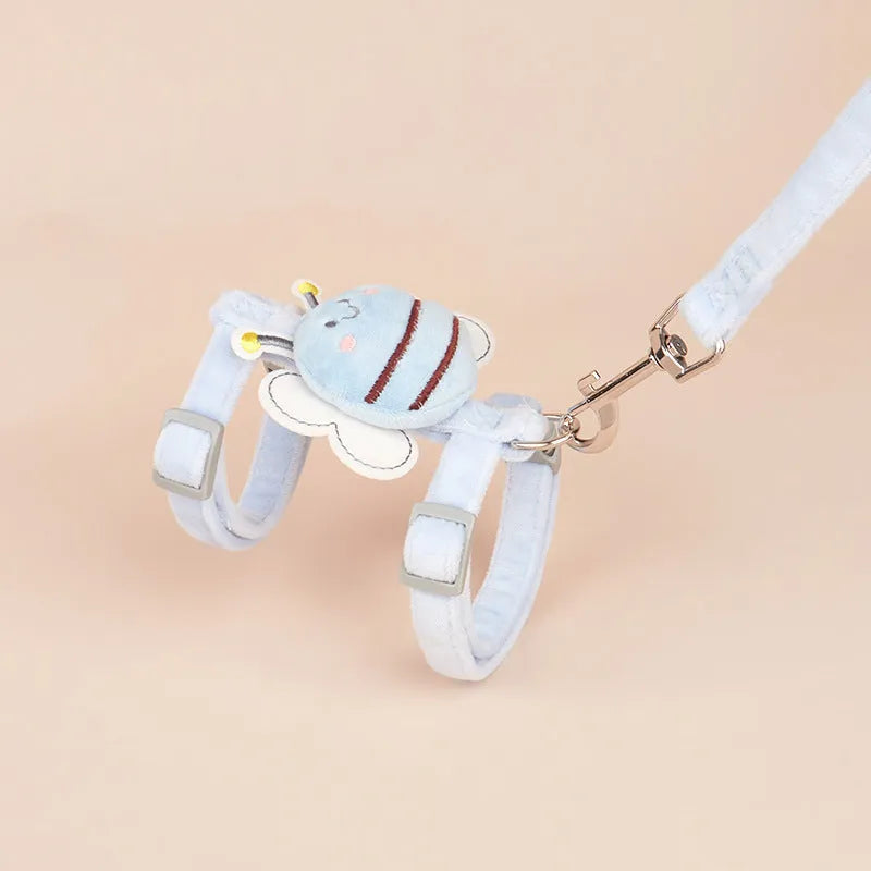 Colourful bee-shaped cat leash with teddies on a pink background.