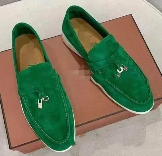 Unisex black slip-on casual loafers with rubber sole and round toe cap on a white background