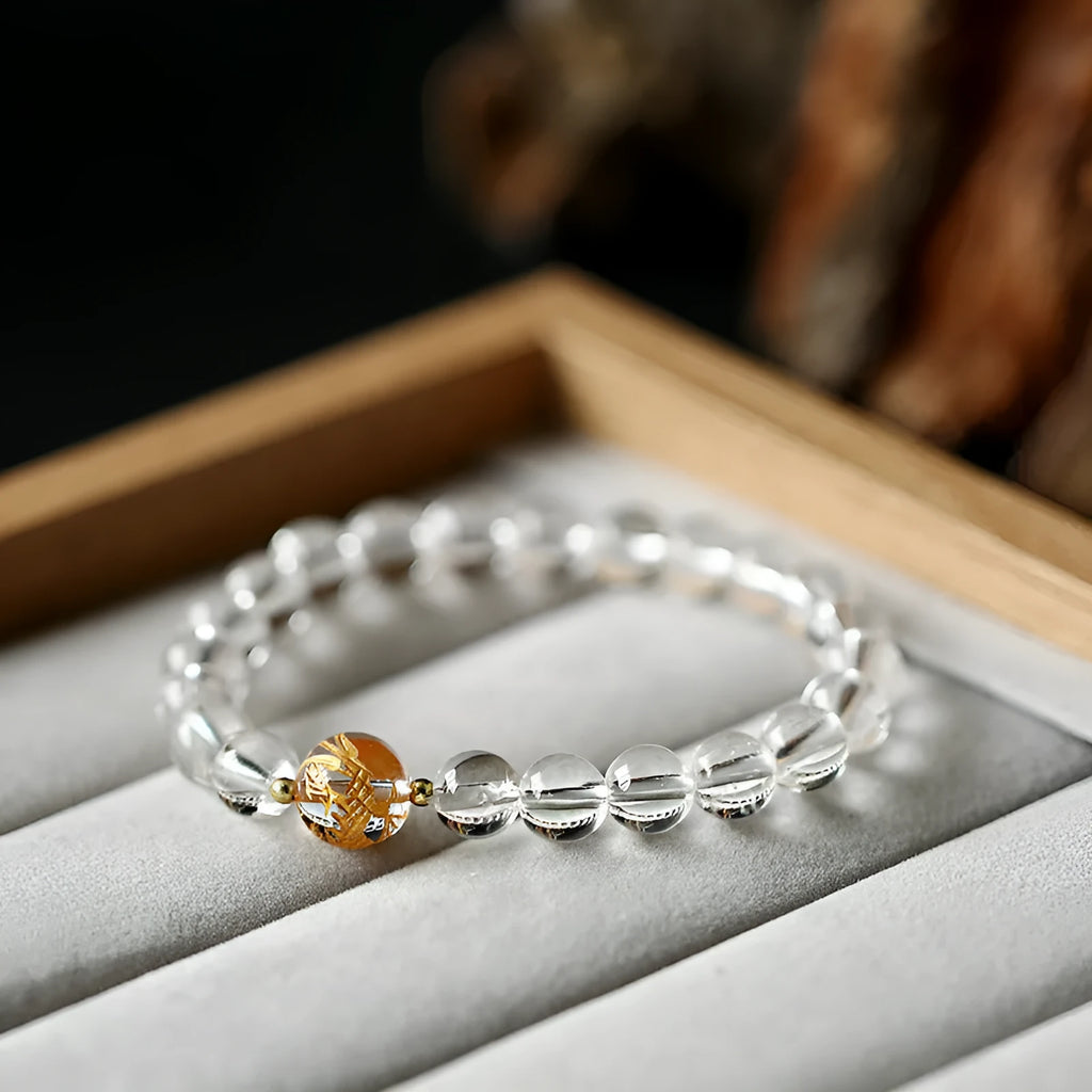 Unisex geometric bead bracelet with black obsidian agate and white crystal stones on a wrist