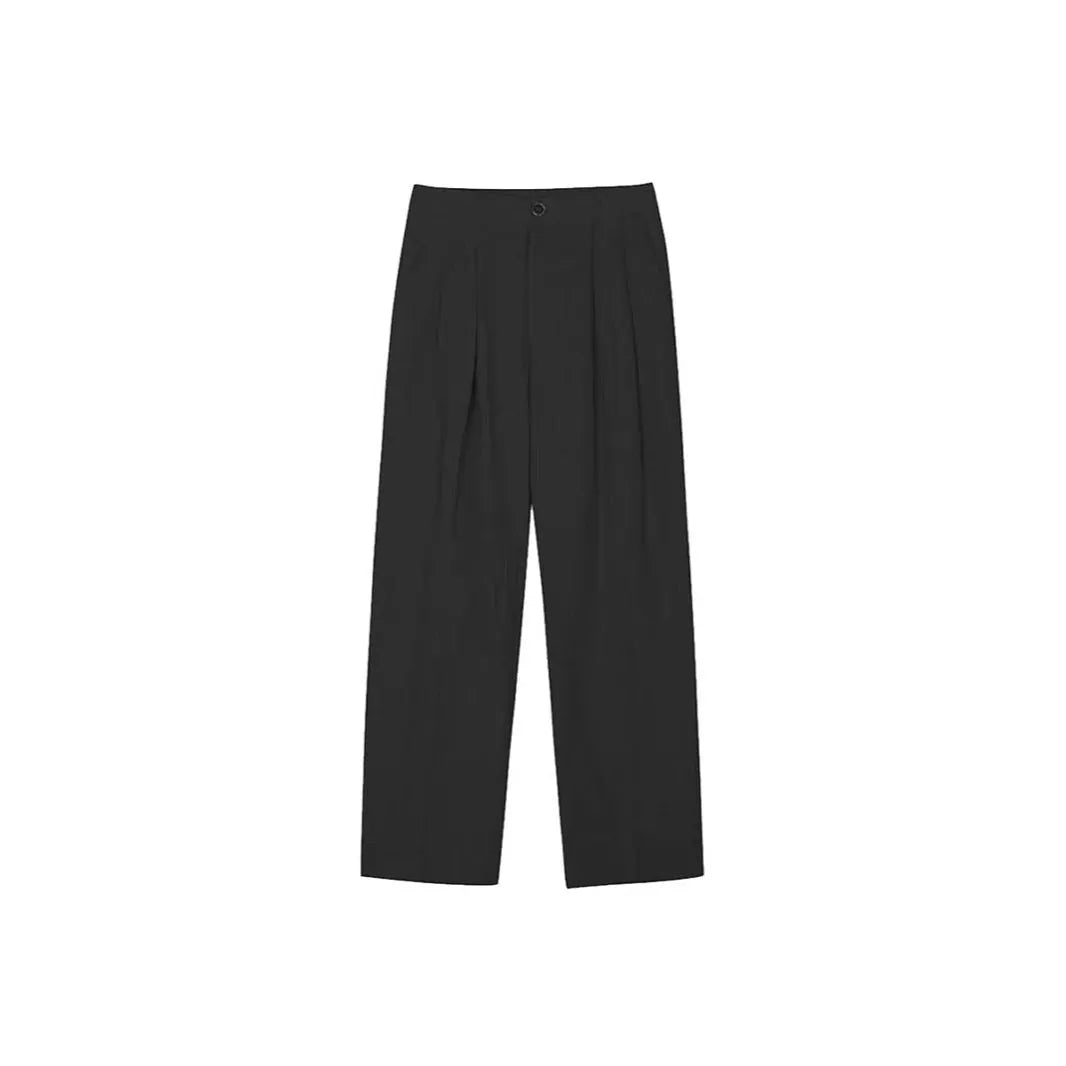 Men's apricot coloured wide-leg cotton linen trousers with a mid waist and zip fly on a neutral background.