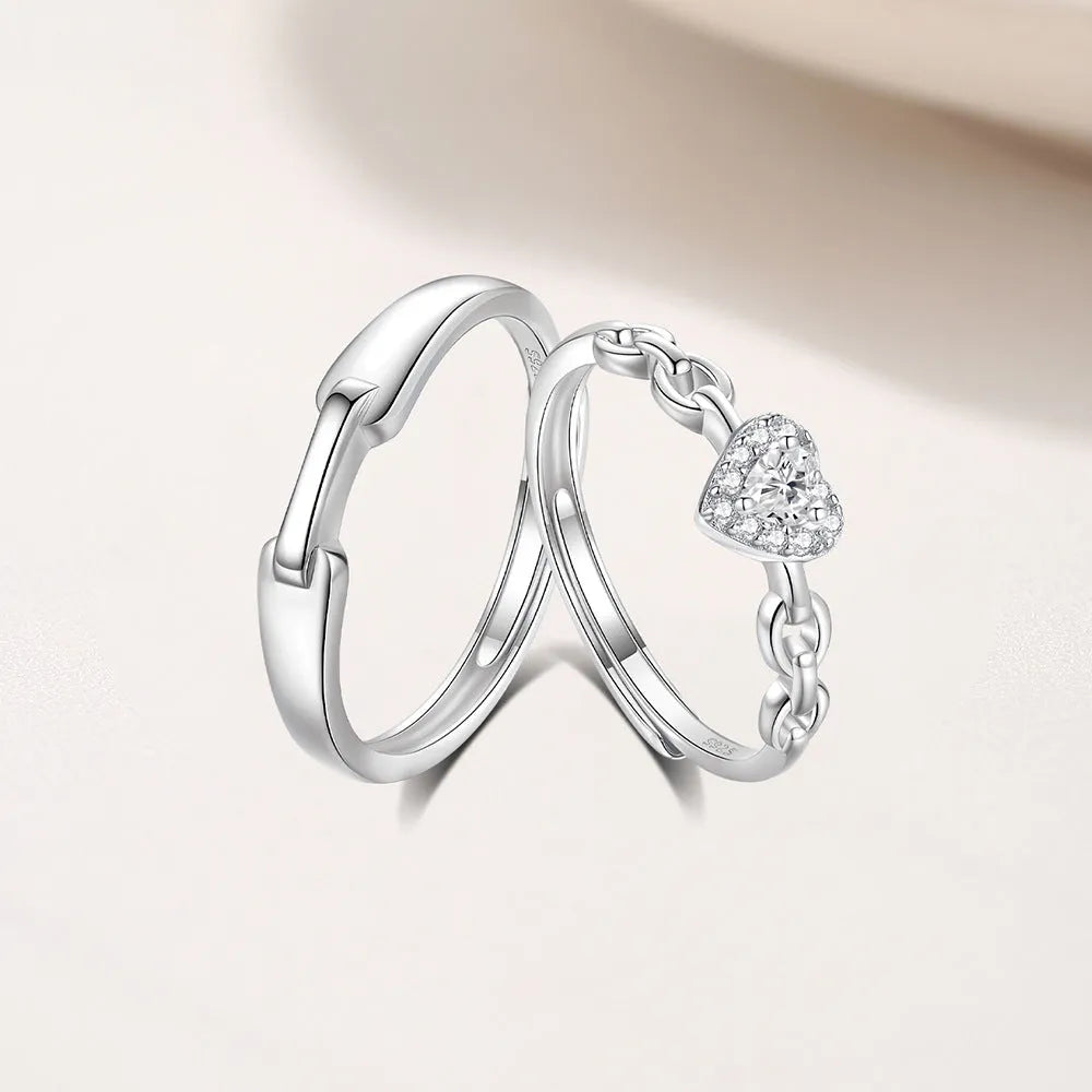 925 silver couple ring with diamond detail and adjustable opening, geometric shape with heart and chain motifs