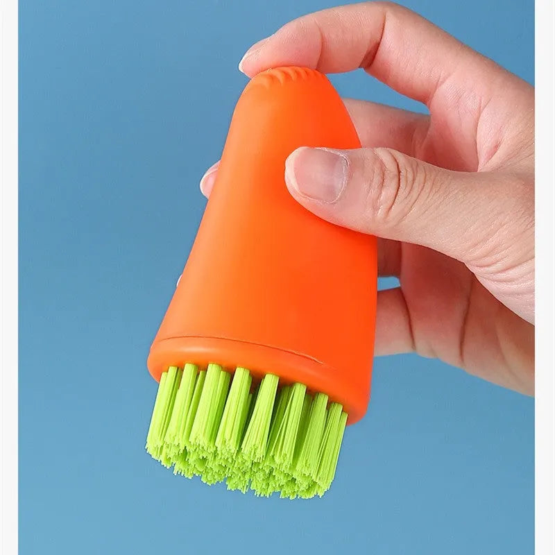Carrot-shaped nylon cleaning brush in orange and white colours for kitchen vegetable washing