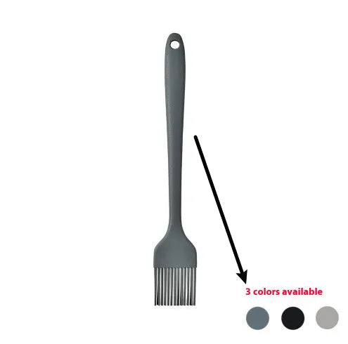 Black silicone kitchen utensil set with 12 tools stored in a rotating plastic storage bucket on a worktop.