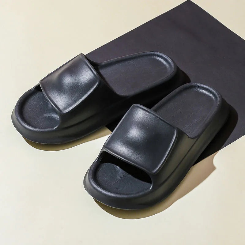 Thick-soled EVA flip flop slippers in multiple colours on a white background.