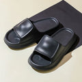 Thick-soled EVA flip flop slippers in multiple colours on a white background.