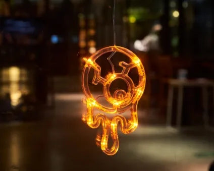 Seven Halloween themed battery-operated LED hanging lights with spider, pumpkin and ghost designs