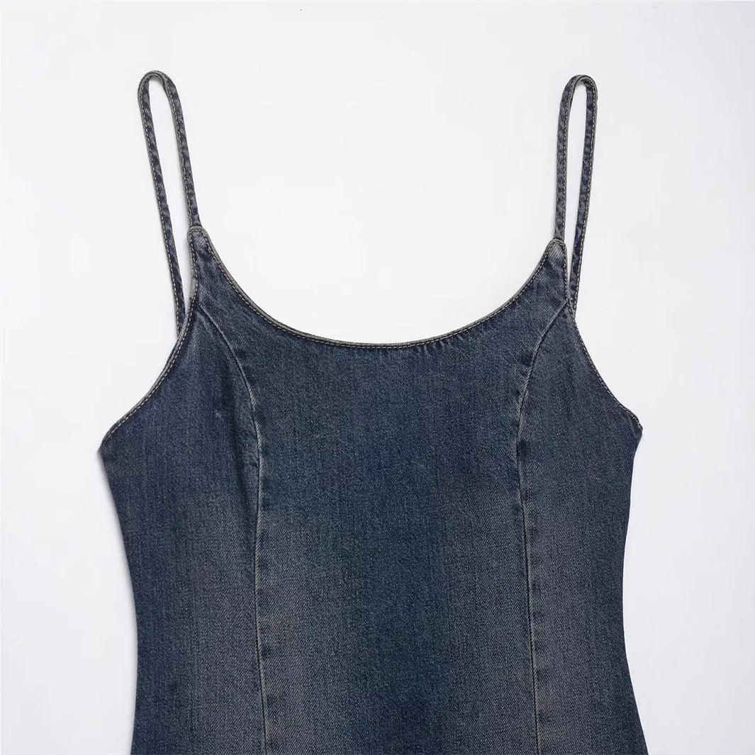 Women's blue knitted denim-look short dress with hood, pleated asymmetrical hem, and long sleeves on a model.