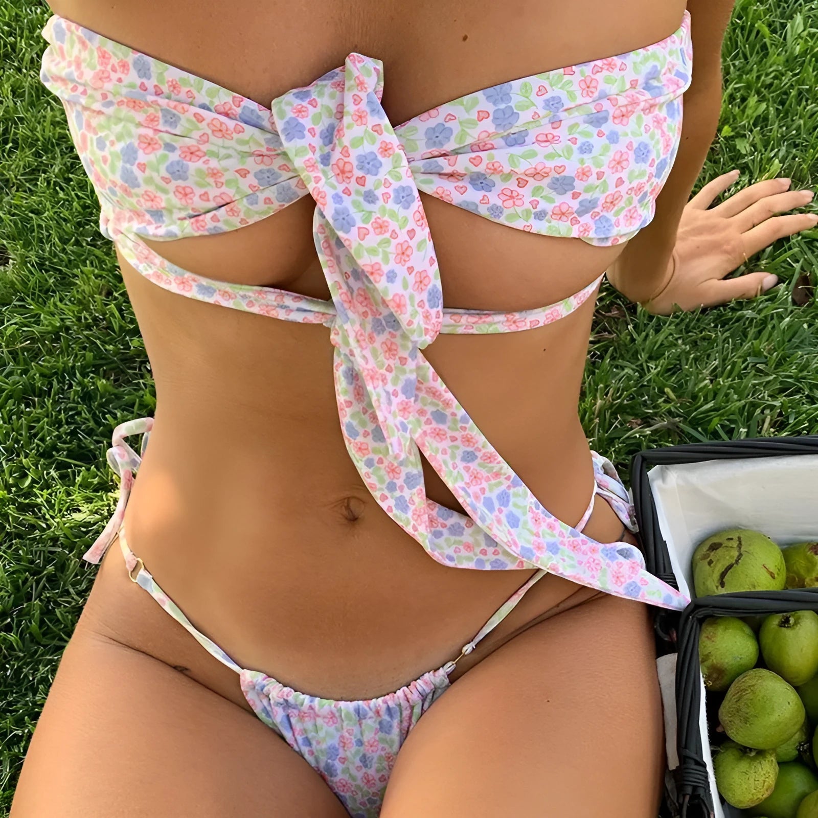 Women's lace-up front swimsuit with wireless padded cups and split briefs in a floral print
