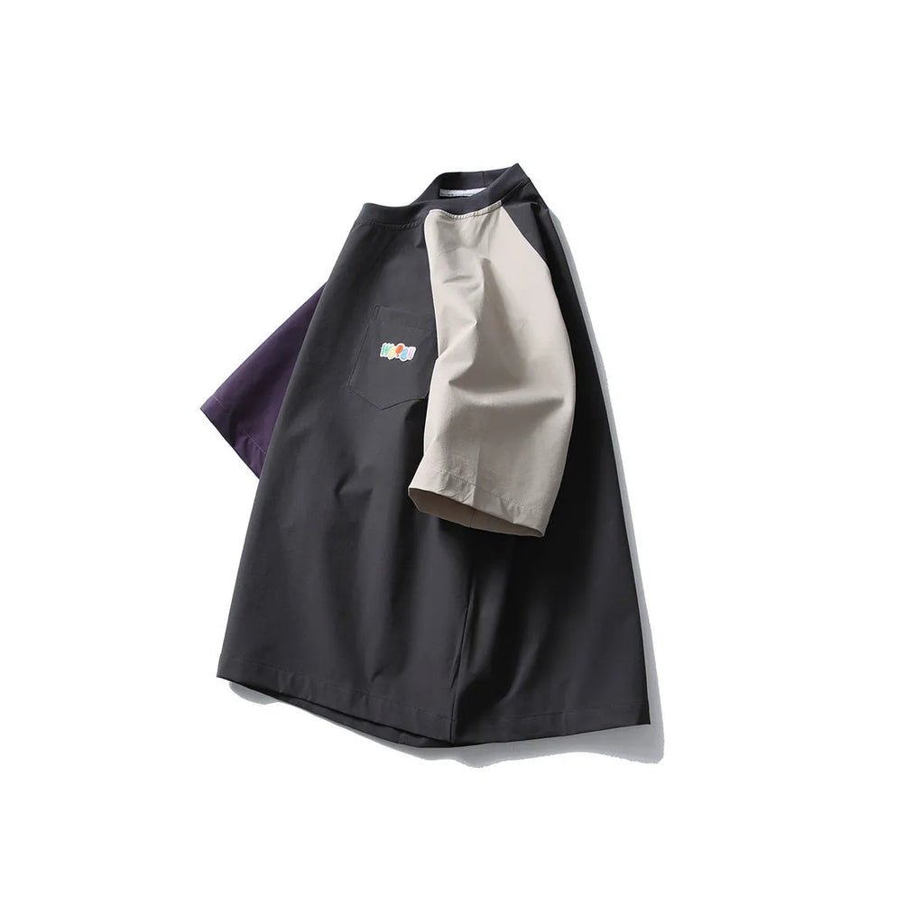 Dark grey loose fit t-shirt with raglan sleeves and contrast colour details.