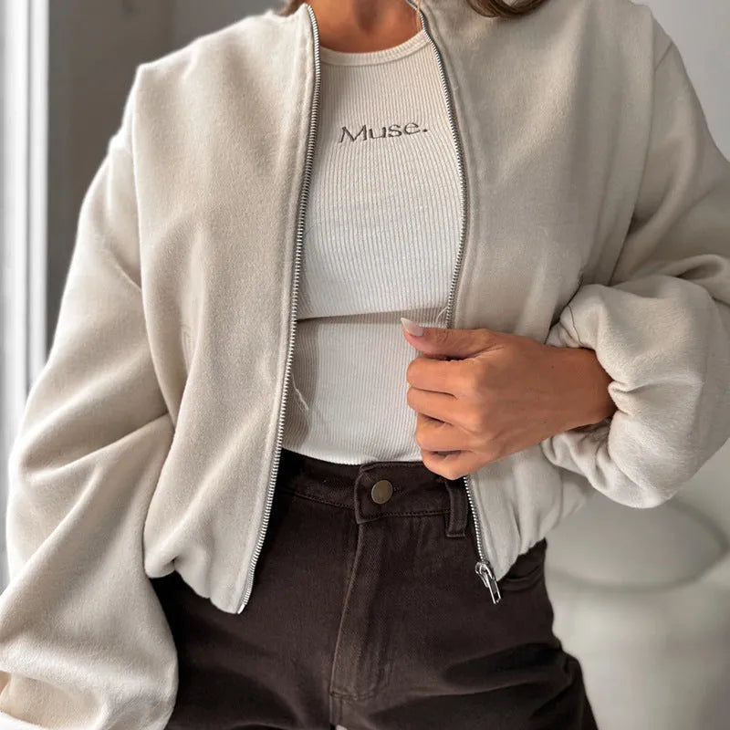 Women's off-shoulder short coat with lantern sleeves in brown colour showing round neck and pocket details