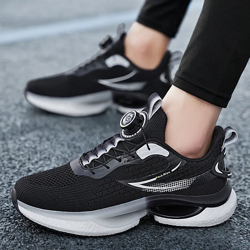 Low-top white running shoes with a rotating button buckle on a breathable mesh upper and a textured TPU sole.