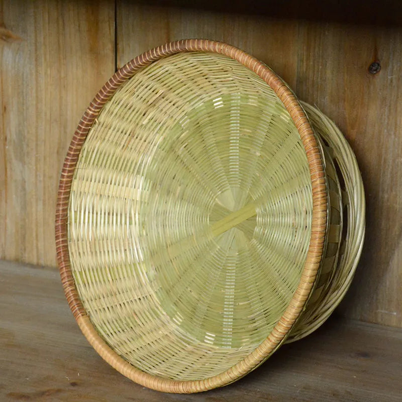 Handmade natural bamboo storage basket showing woven texture in three available sizes