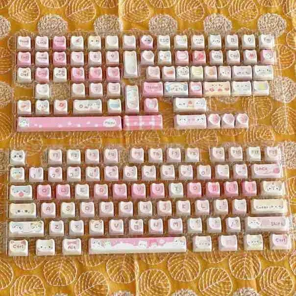 Meow Meow Team mechanical keyboard key cap set showing 141 keys with feline character artwork on all sides