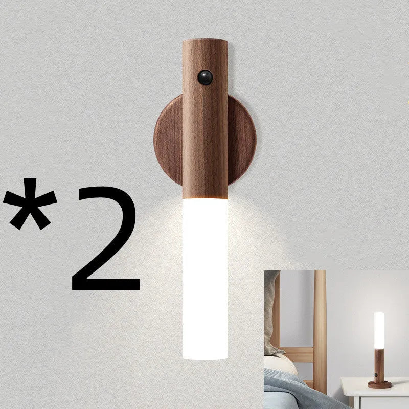 Wooden smart sensor LED desk lamp on a desk, showing compact size and simple design.