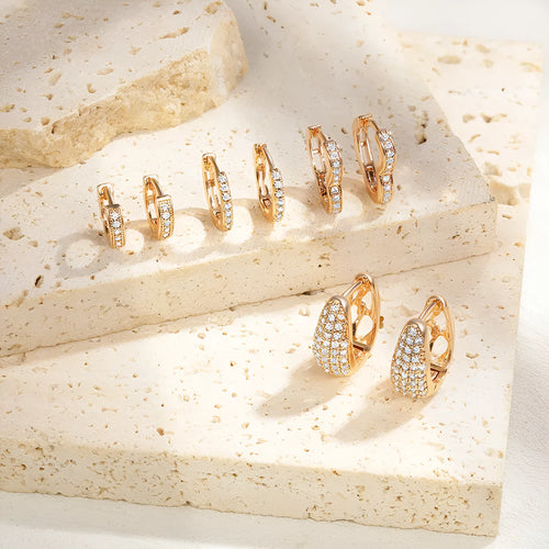 Gold plated heart-shaped ear clip earrings with zircon decoration and gang drill elements