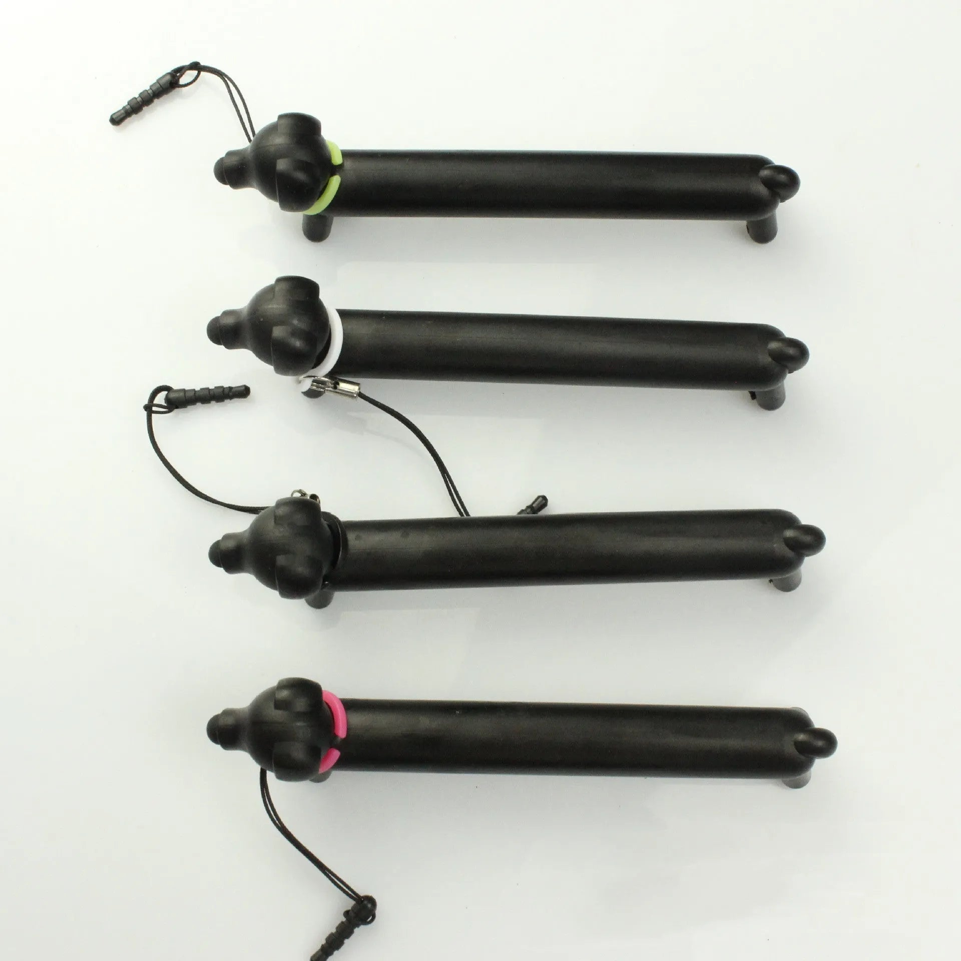 Black dog-shaped touch screen stylus showing phone holder conversion and length adjustment
